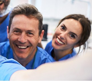 Two healthcare colleagues taking a smiling selfie