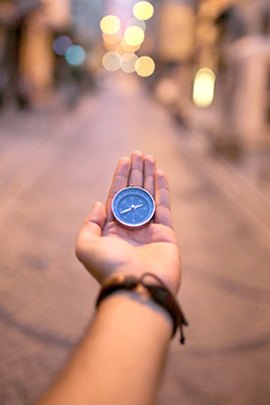 Compass held in a hand