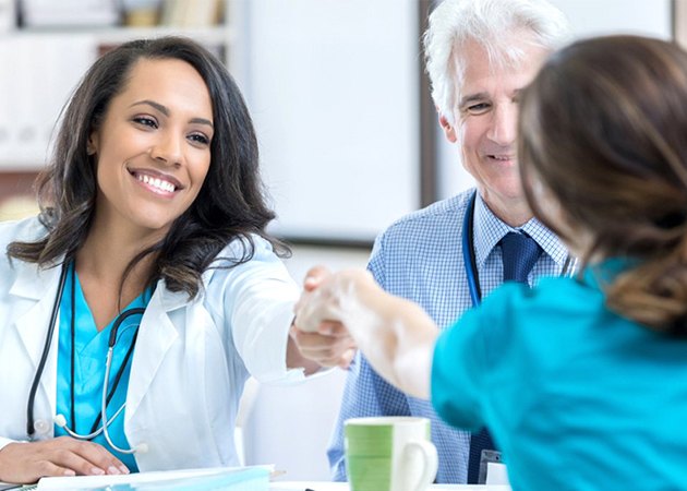 Recruiter shaking hands with a nurse